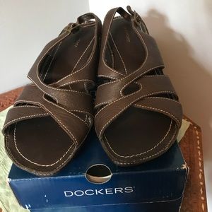 New pair of dark brown leather sandals